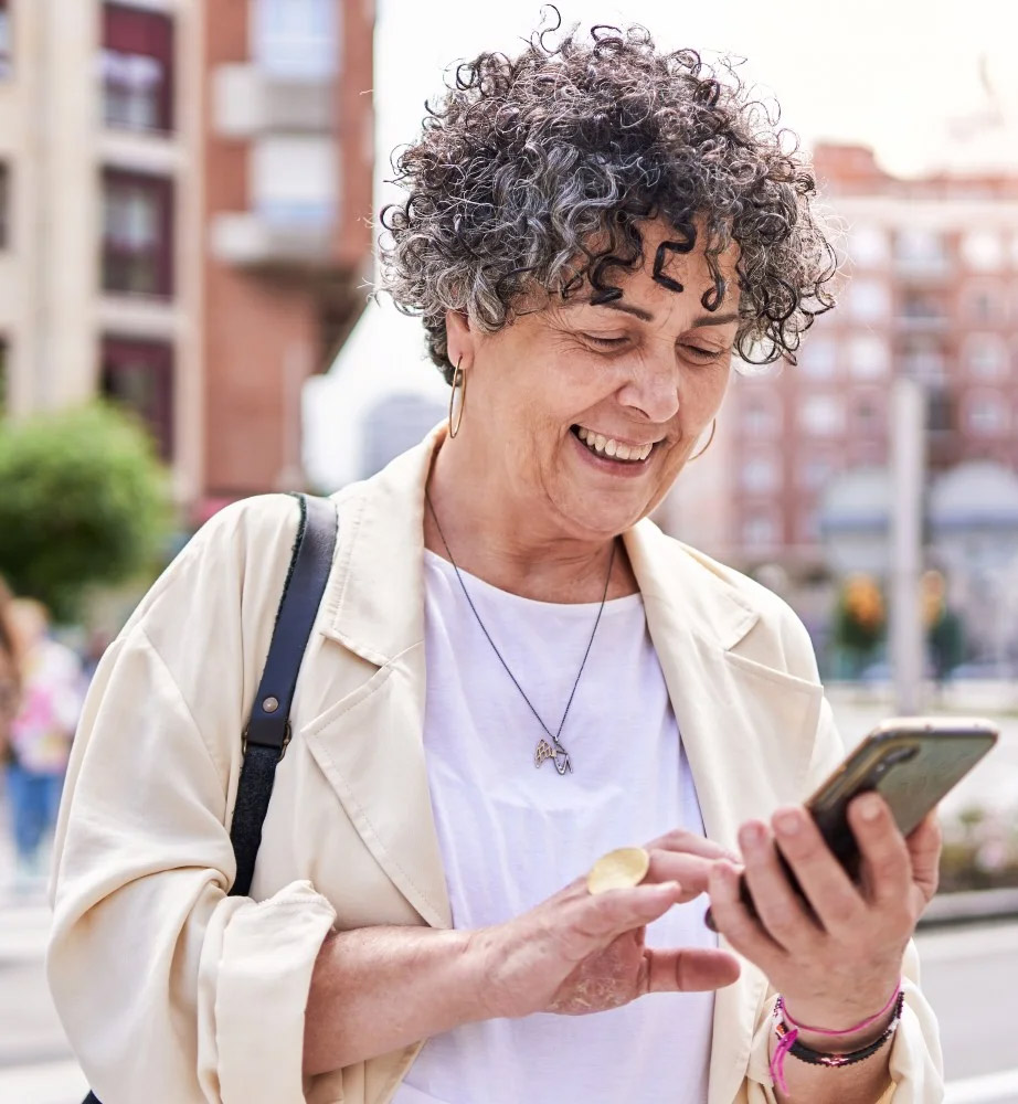 Old lady looking at the phone